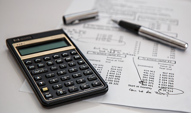 Calculator with a chart of investment accounts.
